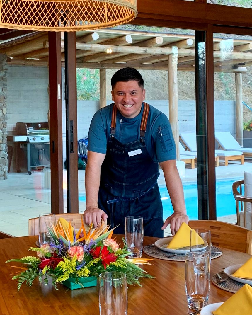 Chef Fabián Argüello behind a dinner table he set in a villa in Guanacaste, Costa Rica