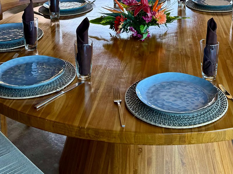 A round table set for dinner in a villa in Guanacaste